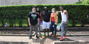 Kids and coworkers gardening